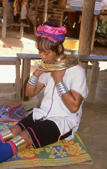 Coil Prints: Thailand: A Padaung (Long Neck Karen) woman removing her neck rings for cleaning