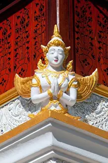 Chiang Mai Prints: Thailand: Sculpture of a thewada (angel) on the Ho Trai or library building