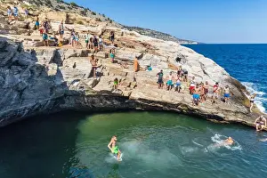 Thassos Prints: Thassos, Greece - July 20, 2019: Tourists are doing diving in the natural swimming pool Giola in Thassos island
