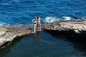 Thassos Prints: Thassos, Greece - July 20, 2019: Tourists are doing diving in the natural swimming pool Giola in Thassos island