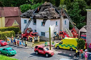 Thatched House Prints: A thatched roof on fire at Babbacombe Model Village, Babbacombe, Torquay, Devon