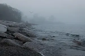 Gloomy Prints: Thick fog on the shore of Lake Ontario in Toronto's Trillium Park with huge boulders in the foreground