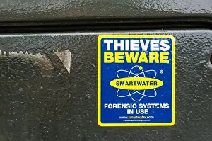 Thieves Beware Smartwater Forensic Systems In Use warning sticker on a telephone street cabinet