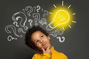 Occupations Prints: Thinking child boy on black background with light bulb and question marks