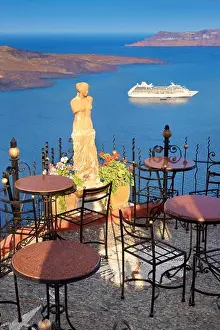 Fira Prints: Thira (capital city of Santorini) - cafe with a background view to sae and cruise ship