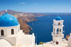 Thira (capital city of Santorini) - greek white church and bell tower overlooking the sea, Santorini Island, Cyclades, Greece