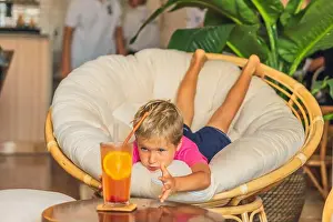 Thirst Prints: Thirsty curious caucasian blond boy want to taste lemonade