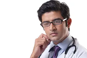 20 25 Years Prints: Thoughtful male doctor over white background