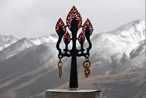 Religions Prints: Tibetan Buddhism symbol trident snow covered mountains Reting monastery Tibet China