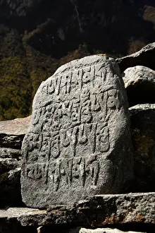Mani Prints: Tibetan inscriptions on a mani stone