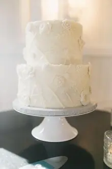 Artful Prints: two tier white wedding cake with floral detail