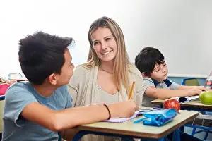 Full time teacher or elementary school teacher tutoring a student