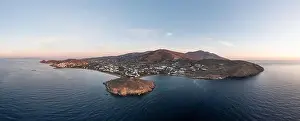Tinos Prints: Tinos island, Cyclades Greece. Aerial panoramic drone view of Agios Ioannis bay at sunset