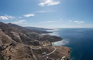 Whitewashed Prints: Tinos island, Cyclades Greece. Aerial panoramic drone view of rocky landscape and coast