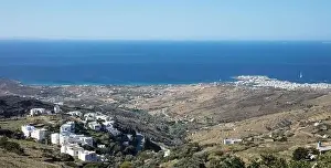Whitewashed Prints: Tinos island, Cyclades Greece. Rocky land and white houses, blue sea and sky, sunny day