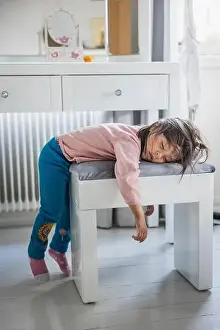 Fatigue Prints: Tired girl sleeping on stool