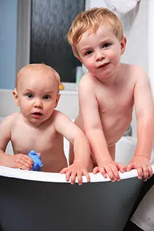 Lovable Prints: toddler and baby portrait at bathtime looking at camera