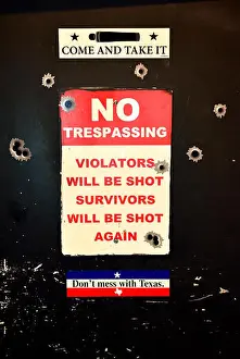 Comical Prints: Toilet door with Texas slogans