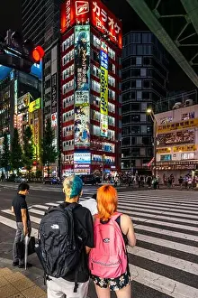 Youngster Prints: Tokyo, Japan, August 13, 2019 – Two youngsters at Akihabara
