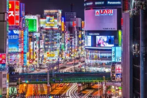 Advertisements Prints: TOKYO, JAPAN - MARCH 19, 2014: Shinjuku district illuminated at night