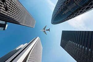 Images Dated 5th April 2017: Tokyo skyscrapers buildings and a plane flying overhead at in Tokyo Shinjuku downtown