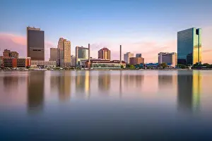 Toledo, Ohio, USA downtown skyline on the Maumee River at dusk