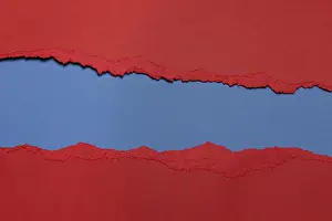 Ripped Prints: Torn Red Paper with circlet's shape and blue background with space for text