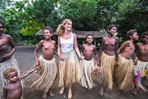 Traditional Attire Prints: Tourist dances with young girls at Yakel Village; Tanna Island, Vanuatu