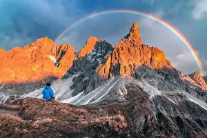 Tourist in Dolomite Alps. Pale di San Martino mountain group in sunset time