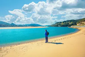 Biscay Prints: A tourist stands on the beach. Laida beach