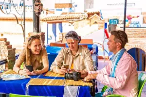 Chefchaouen Prints: Tourists have breakfast in a Moroccan cafe