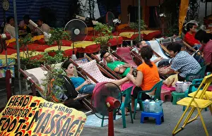 Well Being Prints: Tourists getting foot massage from massage therapists, Koh San Road, Bangkok, Thailand