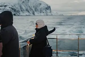 Brim Prints: Tourists on Lyngen Alps tour boat on the arctic ocean in northern Norway