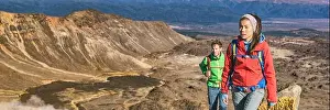 Backcountry Prints: Tourists tramping in New Zealand hike on Tongariro Alpine crossing track
