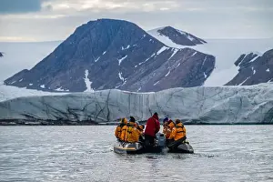 Mountain Backdrop Prints: Tourists in zodiac, Belcher glacier