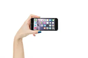Apps Prints: TOURS, FRANCE – February 6 2015: Female hand holding iPhone 6 Space gray variant isolated on white