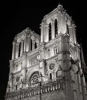 From Below Prints: Towers and Facade of Notre Dame de Paris Cathedral illuminated at night