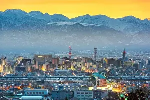 Yama Prints: Toyama, Japan downtown city skyline with Tateyama Mountain at dawn