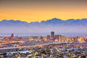 Toyama, Japan downtown city skyline with Tateyama Mountain at dawn