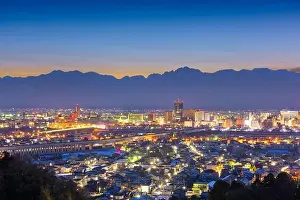 Toyama, Japan downtown city skyline with Tateyama Mountain at dawn