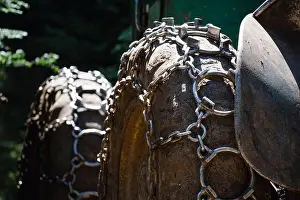 Lumberjack Prints: Traction chains on the big wheel of a forest log truck