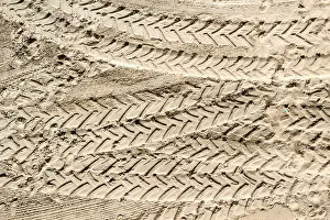 Footprints Prints: Tractor Tyre tracks and footprints on sand
