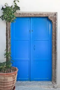 Cyclades Prints: Traditional blue door, typical cycladic architecture of whitewashed houses with colored doors and windows