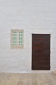 Traditional facade of south adriatic sea house with door and window minimalist decorated in small village of Monopoli, south Italy
