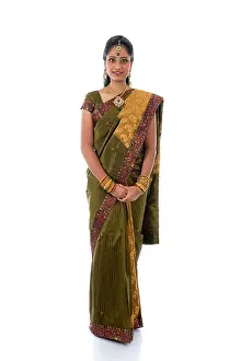 Saree Prints: traditional indian woman in saree with white background full body