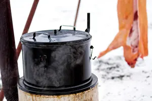 Flesh Prints: Traditional outdoor Czech pig slaughter in winter. Large steaming emanel pot