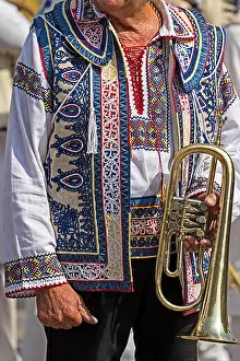 Villager Prints: Detail of traditional Romanian folk costume worn by old singer man from Banat area
