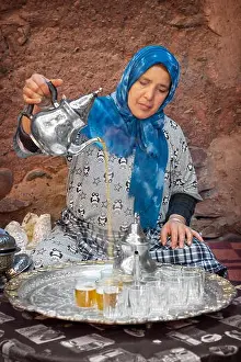 Villager Prints: Traditional tea ceremony. Berber women preparing tea with mint and verbena