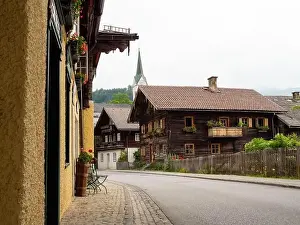 Salzburg Prints: Traditional Timbered Alpine Houses in Center of the Old Village of Goldegg