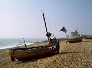 Traditional Boats Prints: Traditional wooden clinker-built fishing boats and Georgian Martello towers on Fisherman's Beach